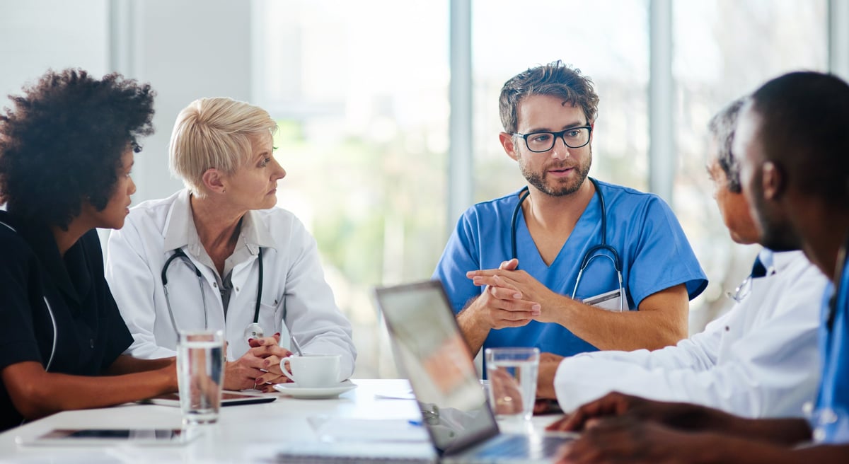 A team of healthcare professionals meeting together